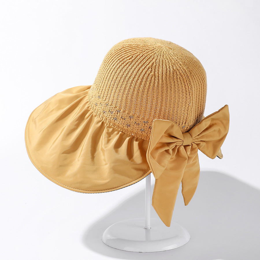 Women's Wide Brim UV Protection Sun Hat — Adjustable Beach Hat with Bow Detail